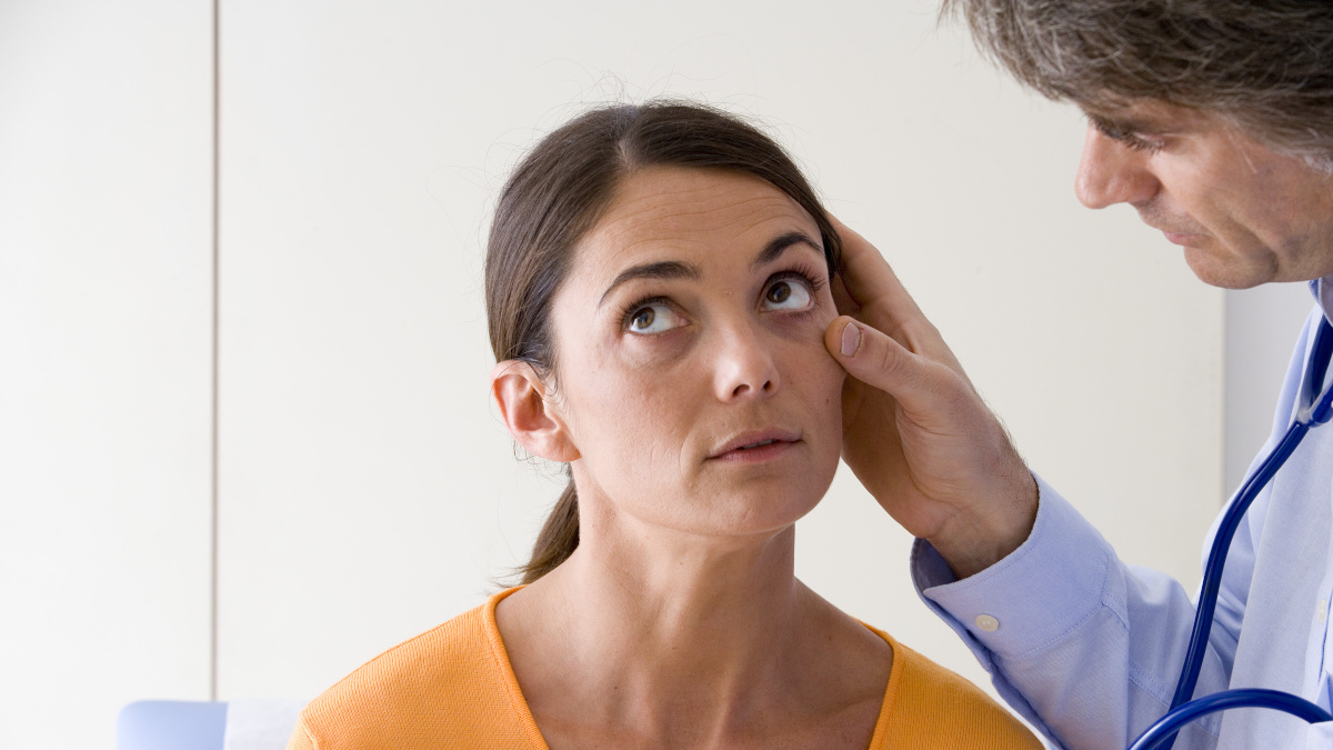 Doctor examining an anaemic woman lacking in iron