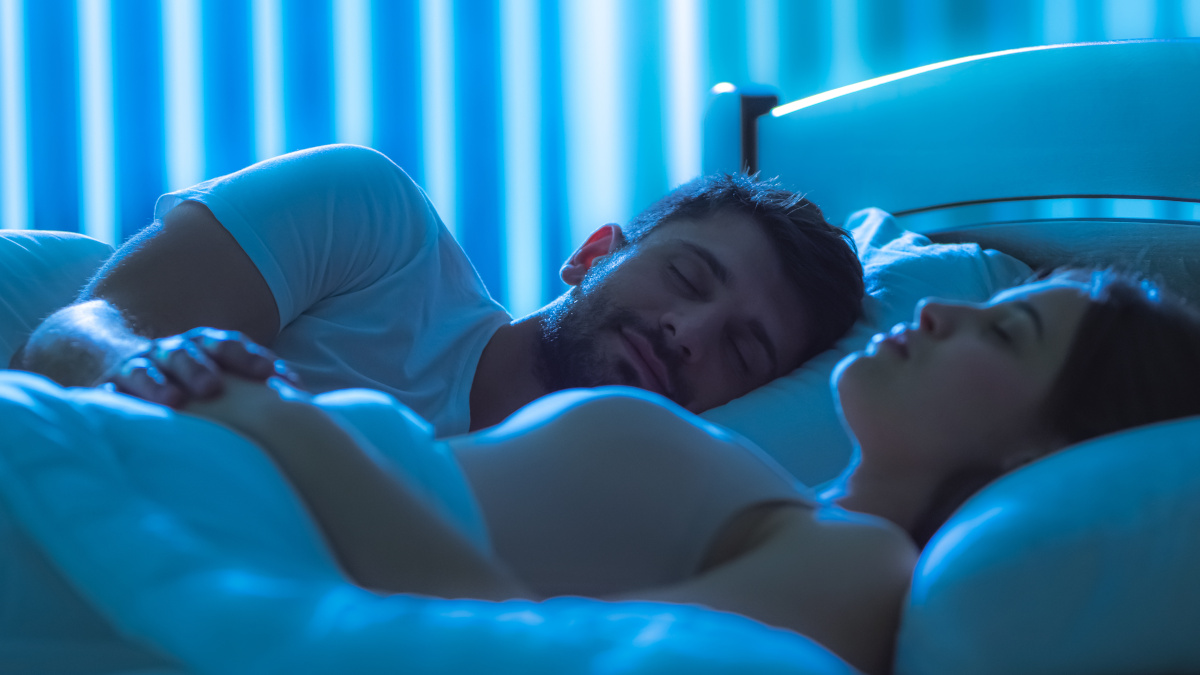 Couple lying down asleep Couple asleep in bed