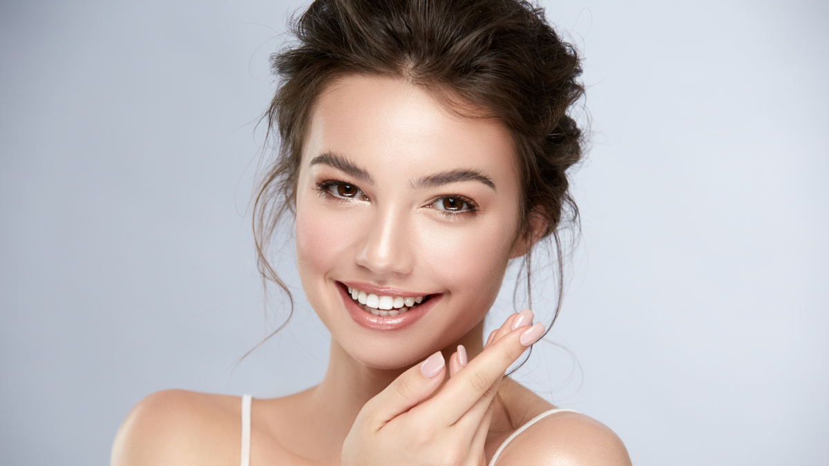 Smiling woman with beautiful, moisturised skin