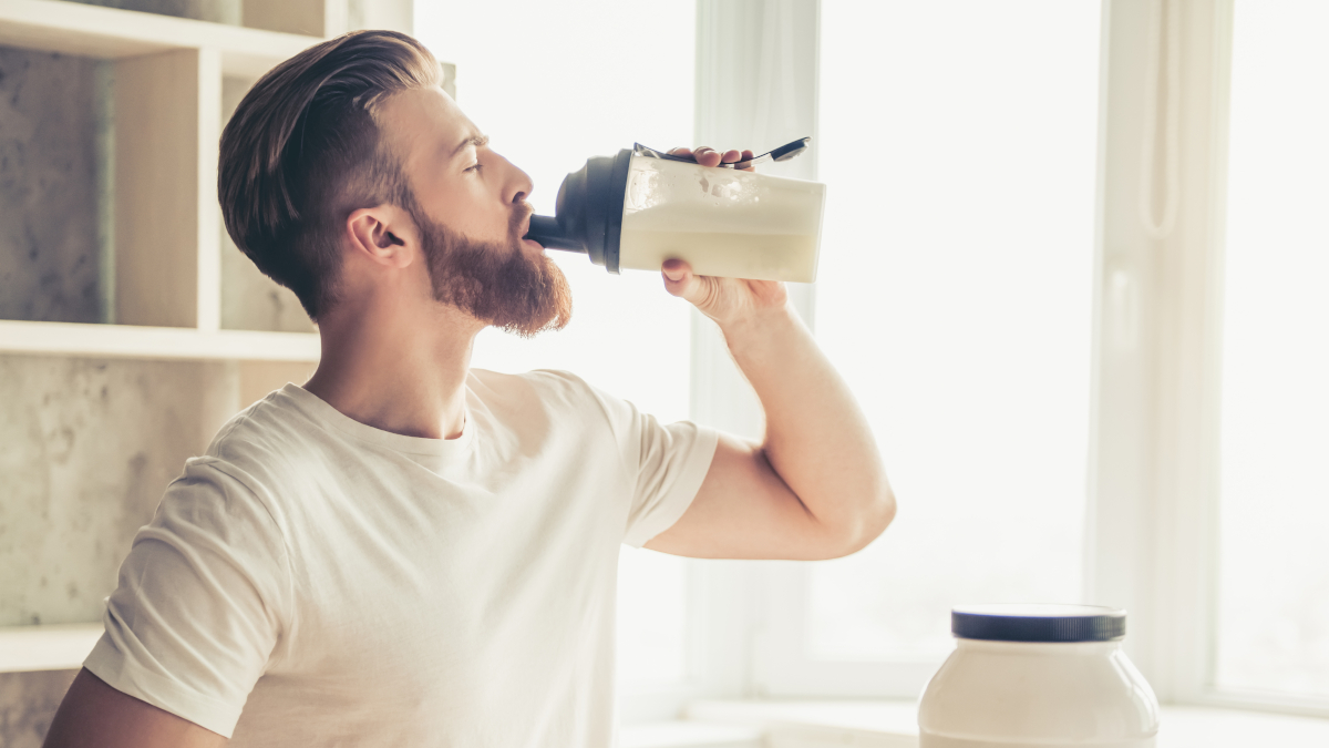 Bodybuilder taking a creatine supplement