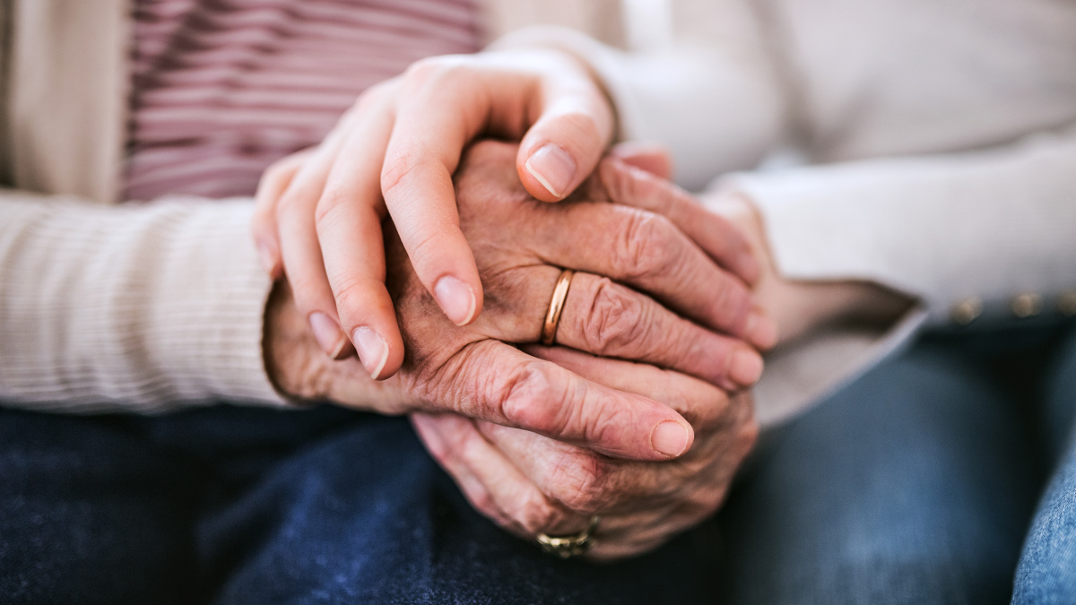 Older person’s hands showing wrinkles and aging spots