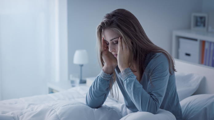 Woman in bed suffering from sleep problems